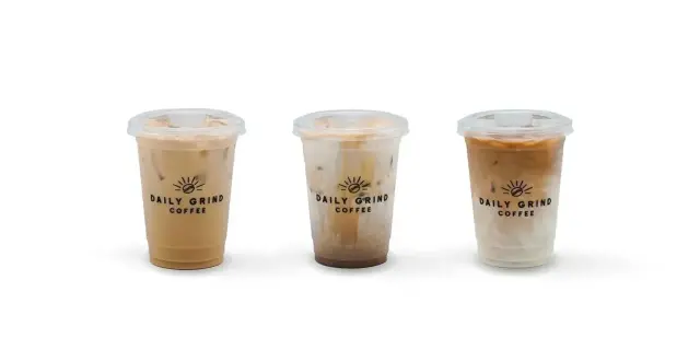Daily Grind iced Spanish latte, iced latte and iced caramel macchiato in branded cups, side by side