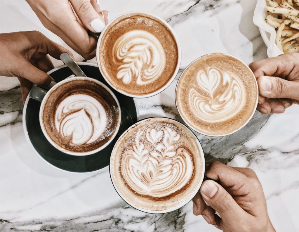 four friends enjoying cups of coffee 1024x794 1